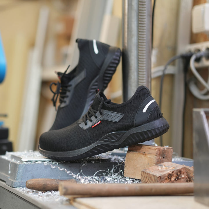 Professionelle Herren-Arbeitsschuhe, schwarz, knöchelhoch, rutschfest für optimale Arbeitssicherheit.