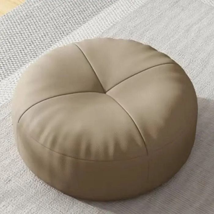 Rundes Bodenkissen für flexible Sitzgelegenheiten. Kombiniert Stil mit praktischem Nutzen.