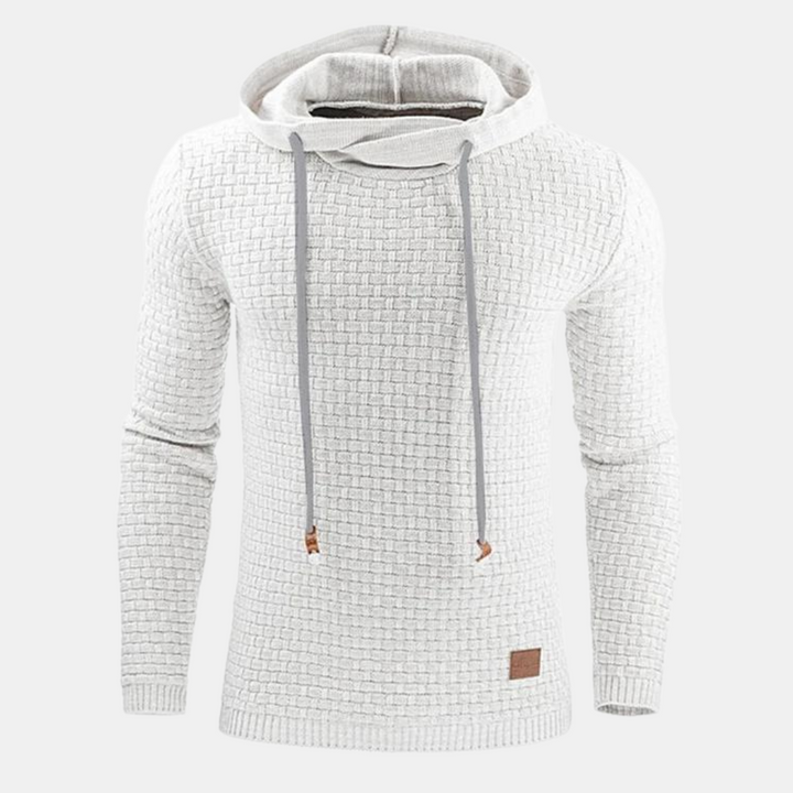 Männliches Model in lässigem Herren Hoodie mit Vintage-Muster. Bequemer Freizeit-Pullover für Herbst-Winter Streetwear.