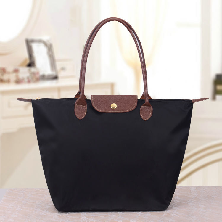 Elegante Damentasche im Oxford-Stil. Geräumige Schultertasche, ideal für Büro, Freizeit und Reisen.