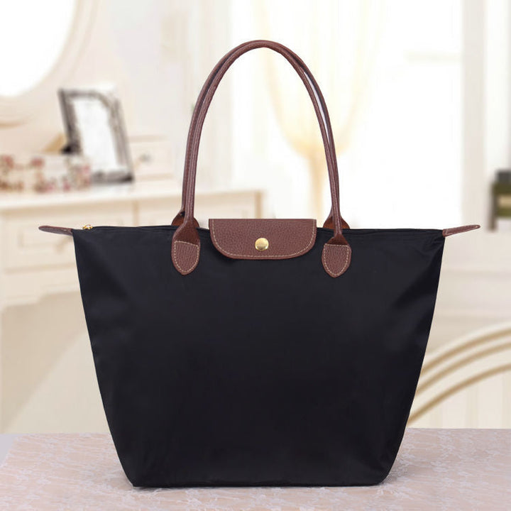 Elegante Damentasche im Oxford-Stil. Geräumige Schultertasche, ideal für Büro, Freizeit und Reisen.