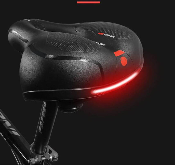 Vorderansicht: Ergonomischer roter/blauer Fahrradsattel, Gel-Komfort für optimale Druckentlastung beim Radfahren.