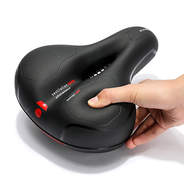 Roter & blauer Komfort-Fahrradsattel, ergonomisch geformt für schmerzfreies Radfahren mit Dämpfung.